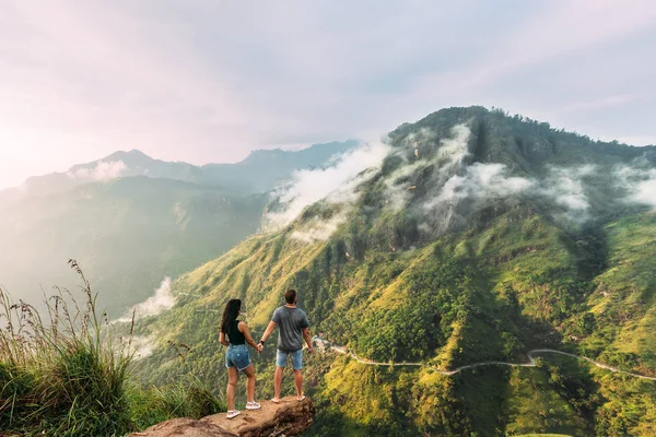 depositphotos_180660100-stock-photo-couple-greets-sunrise-mountains-boy