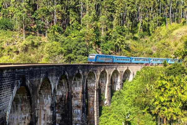 depositphotos_659240046-stock-photo-old-train-nine-arch-bridge